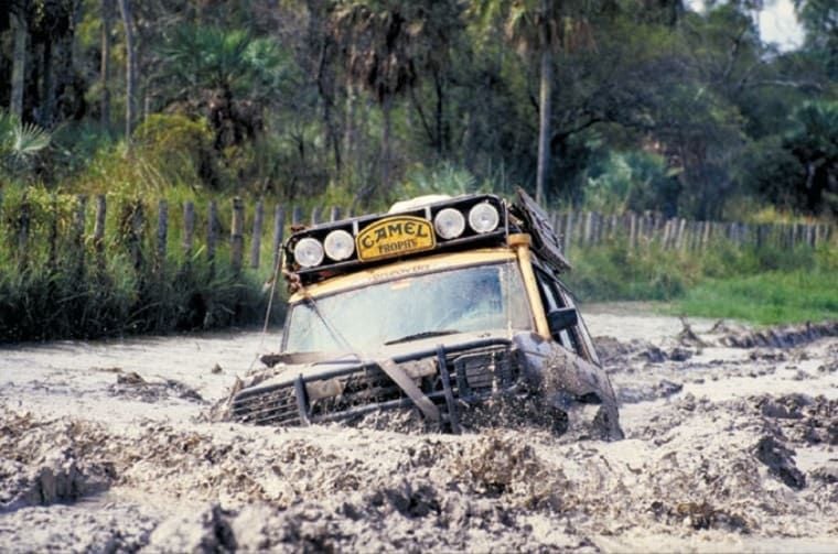 The car is driving through mud